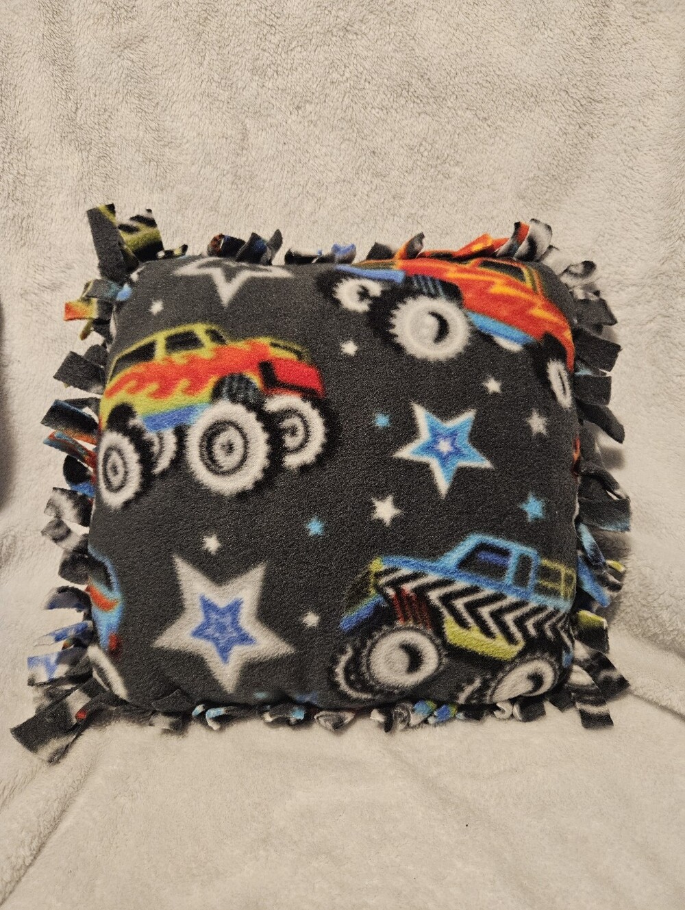 Handmade no sew monster truck fleece accent pillow.  Machine washable,